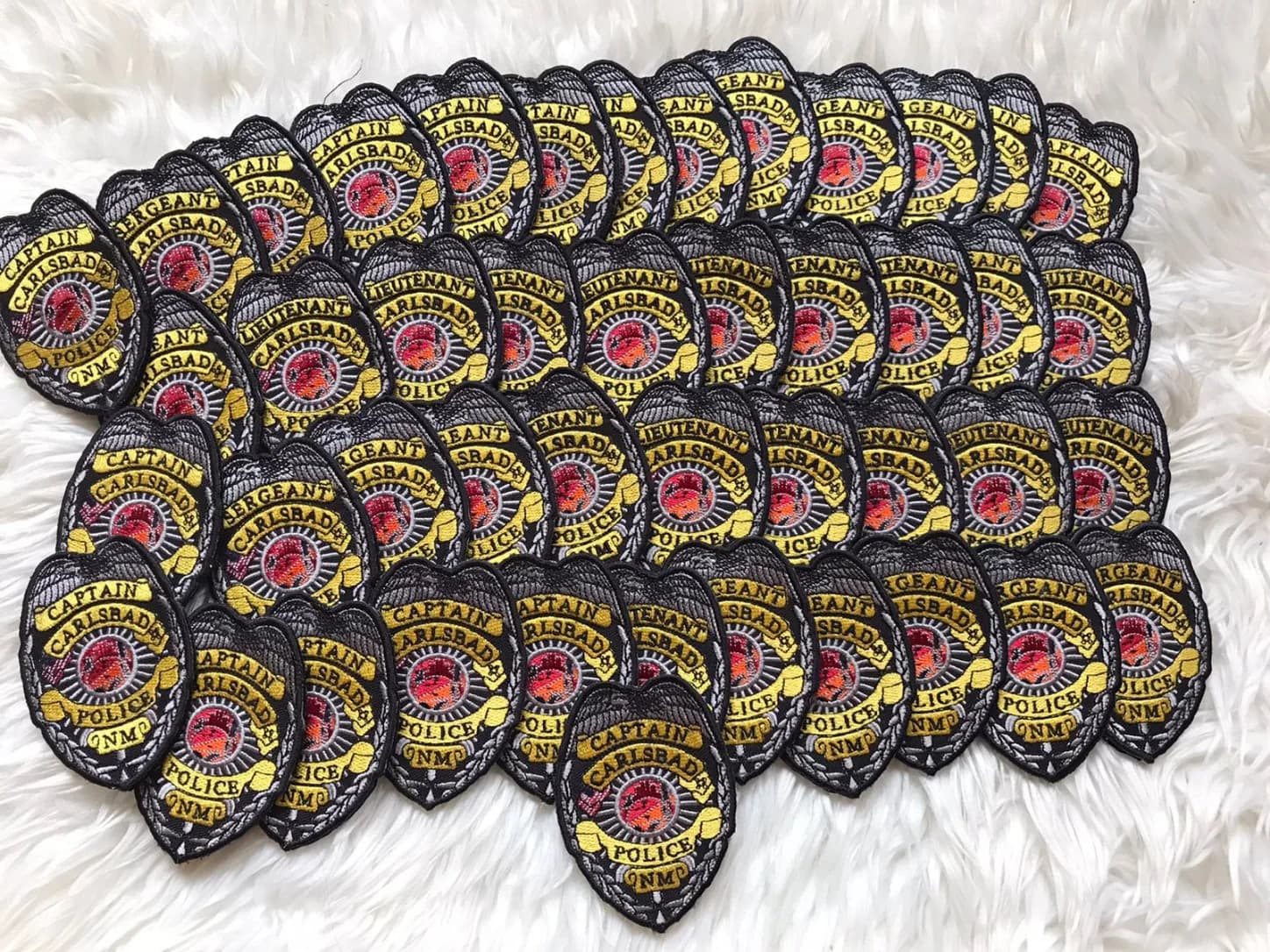 Carlsbad police badge patches with yellow lettering and black borders